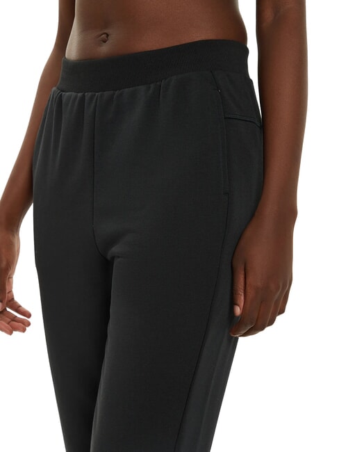 CK PERFORMANCE Pantalones de ch&aacute;ndal con tobillos el&aacute;sticos belleza negra - trajes deportivos para mujeres