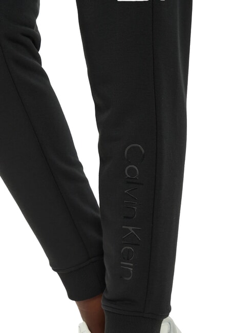 CK PERFORMANCE Pantalones de ch&aacute;ndal con tobillos el&aacute;sticos belleza negra - trajes deportivos para mujeres